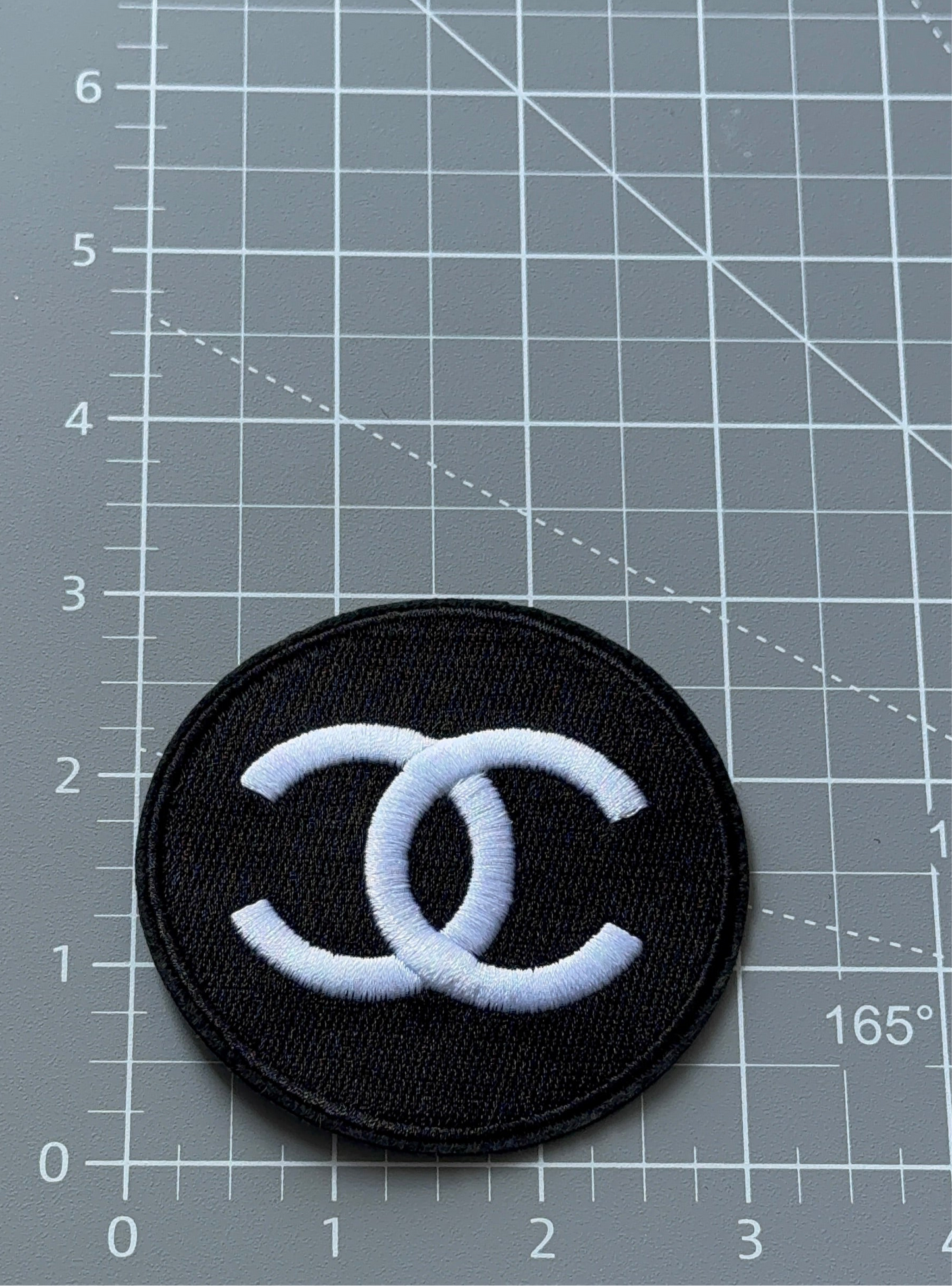 C. C black and white round patch