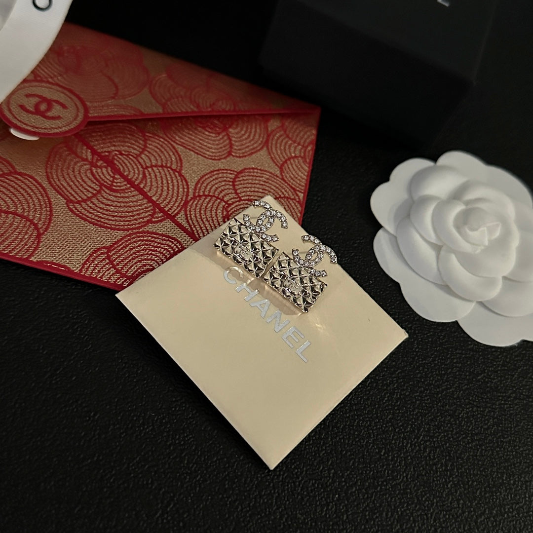 High quality C. C Gold purse earrings