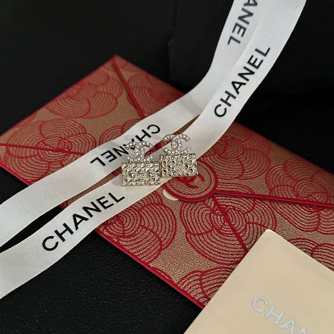 High quality C. C Gold purse earrings