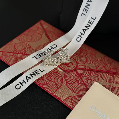 High quality C. C Gold purse earrings