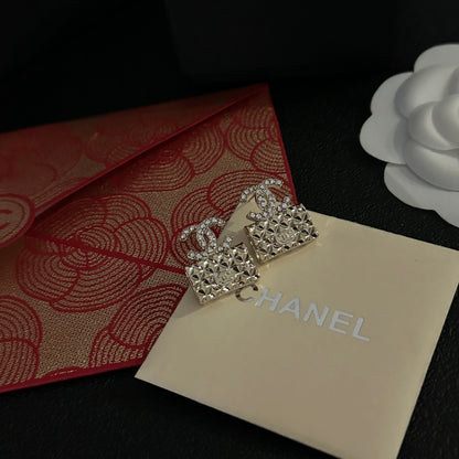 High quality C. C Gold purse earrings