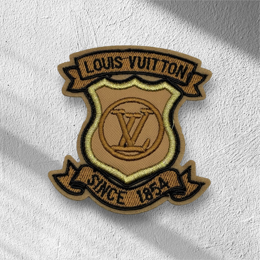 Brown L Logo Patch