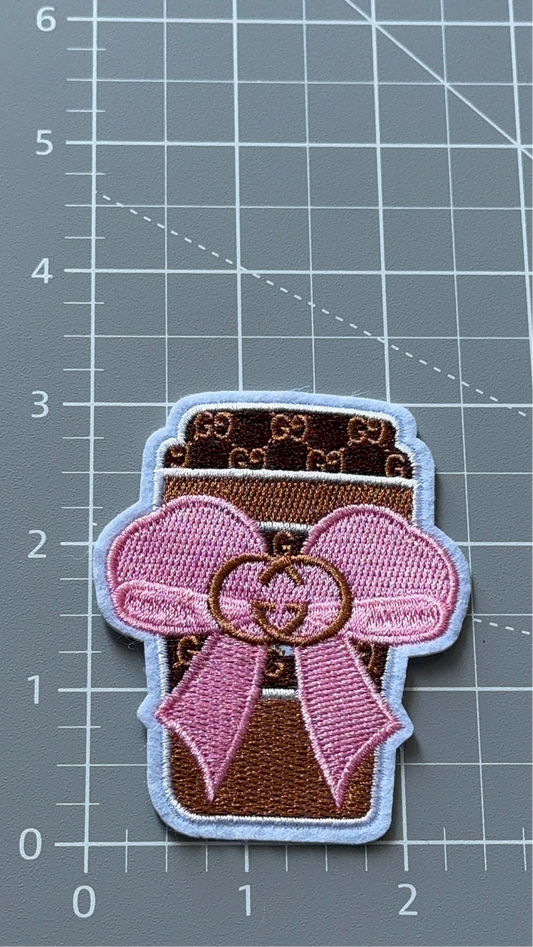 C. C Pin and brown coffee cup patch