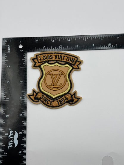 Brown L Logo Patch