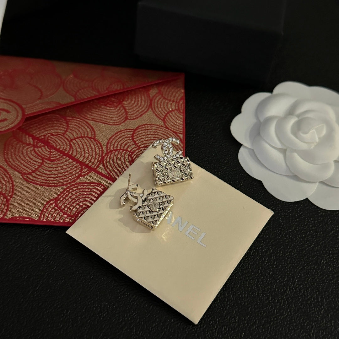 High quality C. C Gold purse earrings
