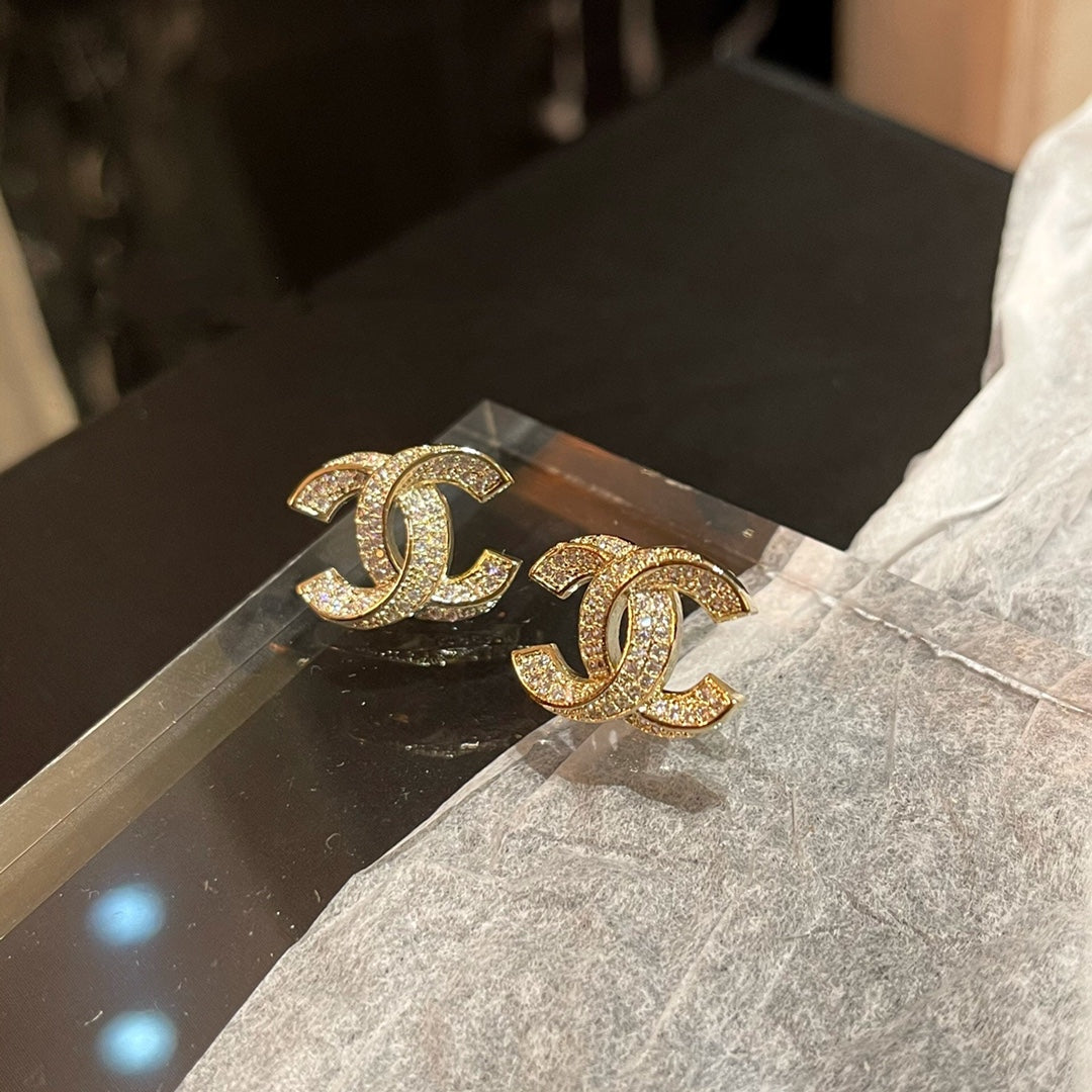 C.C Detailed diamond earrings