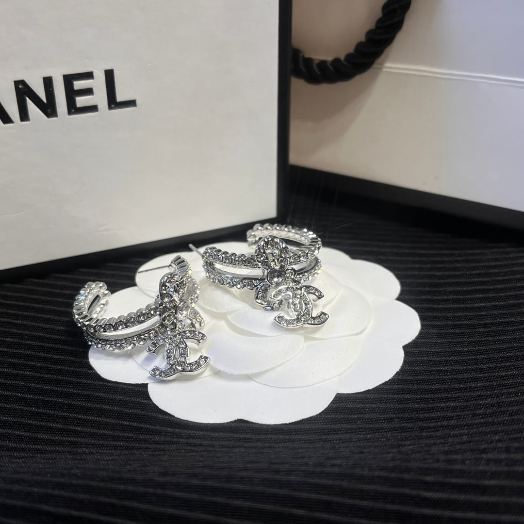 C.C brand silver diamond-encrusted bow earrings