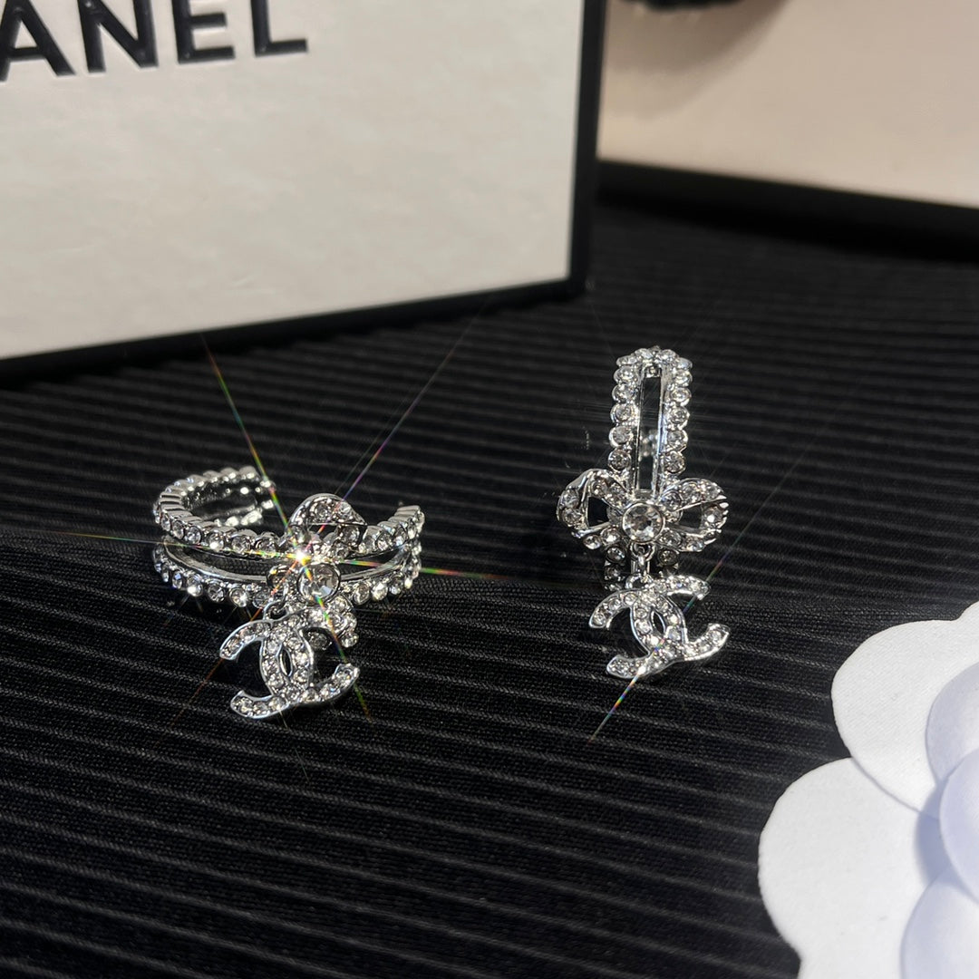 C.C brand silver diamond-encrusted bow earrings