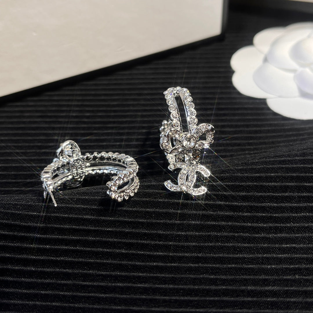 C.C brand silver diamond-encrusted bow earrings