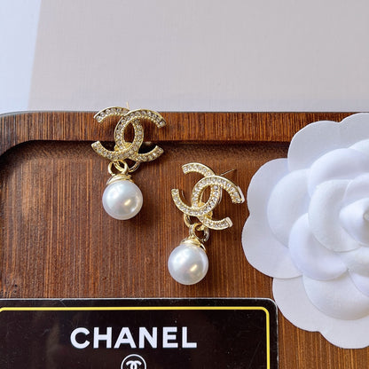 C.C Brand round pearl earrings with zirconia